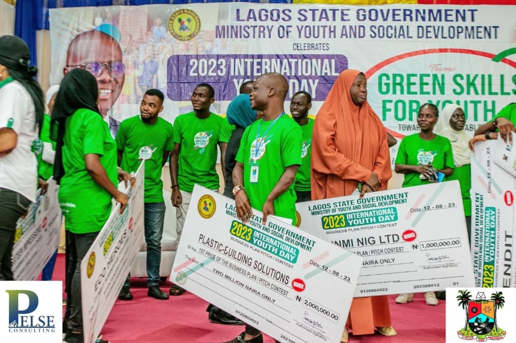 Business plan pitch contest winners receiving grant cheques from Lagos State Ministry and Pelse Consulting officials